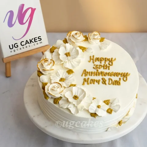 Anniversary Cake with White Flower on Top