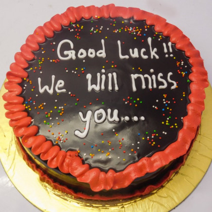 Deliciously Decadent Dark Chocolate Cake with Red Border and Colorful Sprinkles