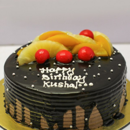 Cherry-topped Chocolate Cake with Fresh Fruits