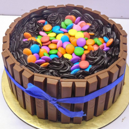 Chocolate Cake with Gems and Cream on Top