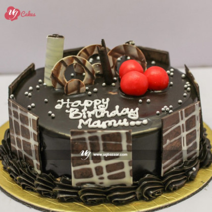 Chocolate Cake with Chocolate Bars and Cherries