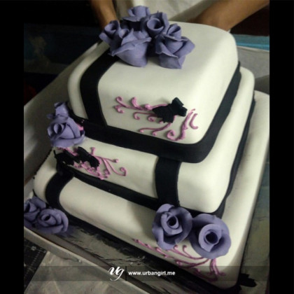 Elegant Triple Decker Wedding Cake with Black Border and Purple Roses