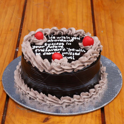 Simple Chocolate Cake with Floral Garland and Cherries