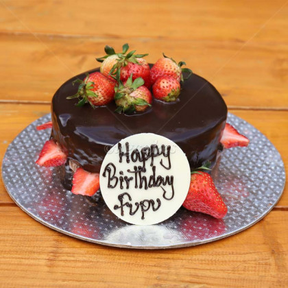 Black Chocolate Cake With Strawberry Toppings