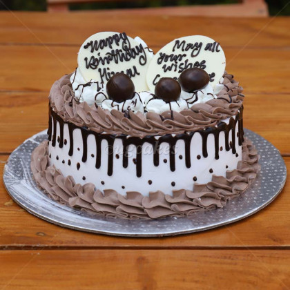 Classic Chocolate Cake with Whipped Cream and Chocoball Toppings