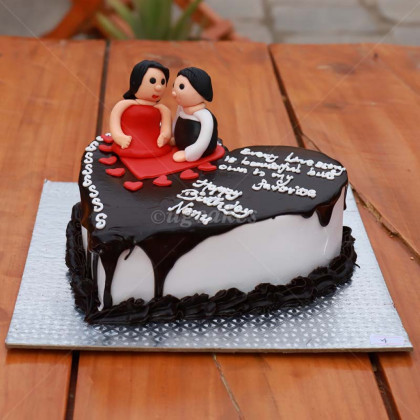 Heart Shaped Chocolate Cake with a Couple on top