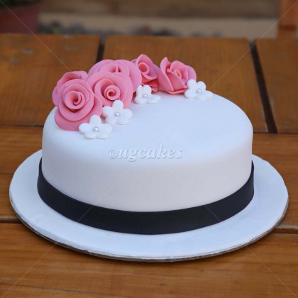 Fondant iced Birthday cake with flowers and border