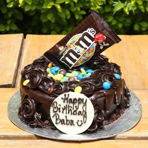 Cake with packets of colorful chocolates