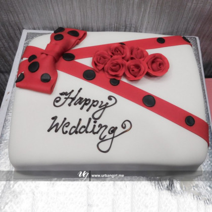 Elegant Dotted Ribbon Wedding Cake