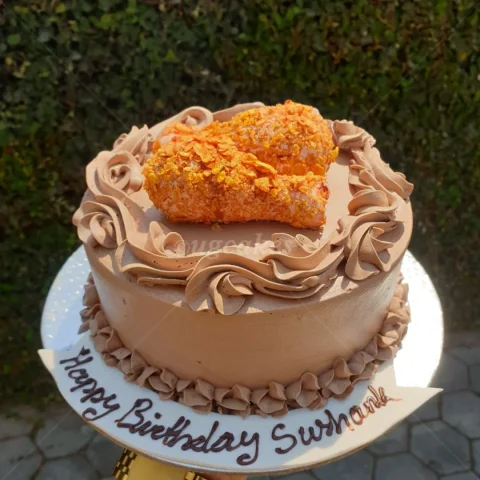 Chocolate cake with drumstick