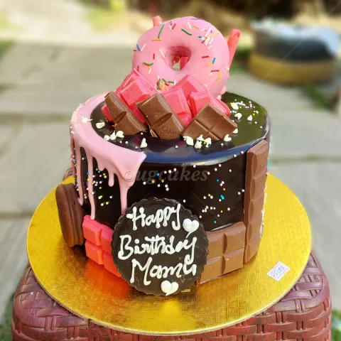 Pink Dripped Tall Cake with Doughnut and Chocolates